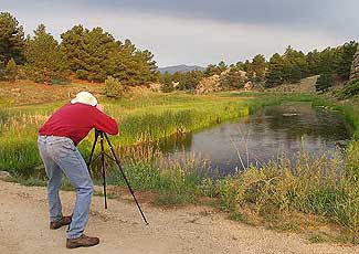 A Photographer Shoots at a Creek