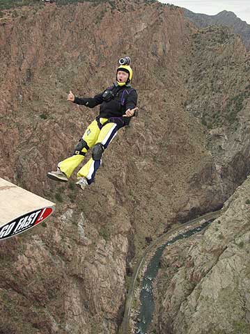 A BASE Jumper dives off the 1053' high Royal Gorge Bridge